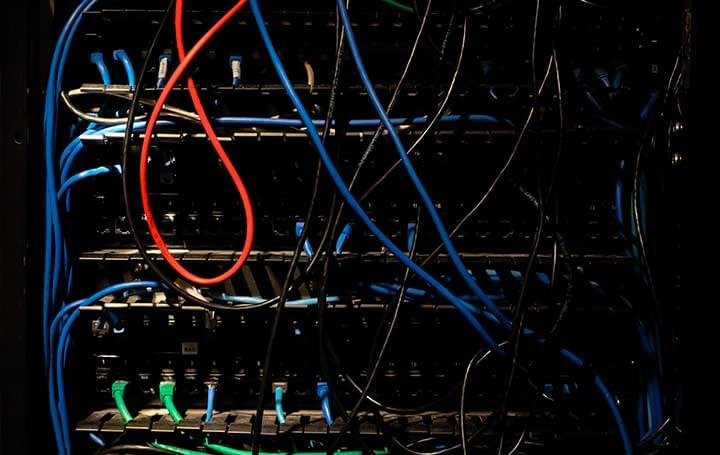 Server rack with network cables, illustrating VPS and shared hosting servers